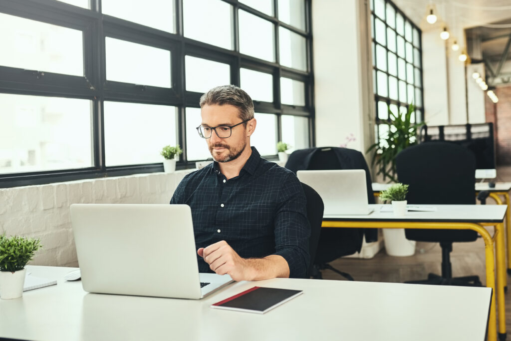 Man at an office desk working on computer